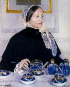 1885. Dama en una mesa de té.